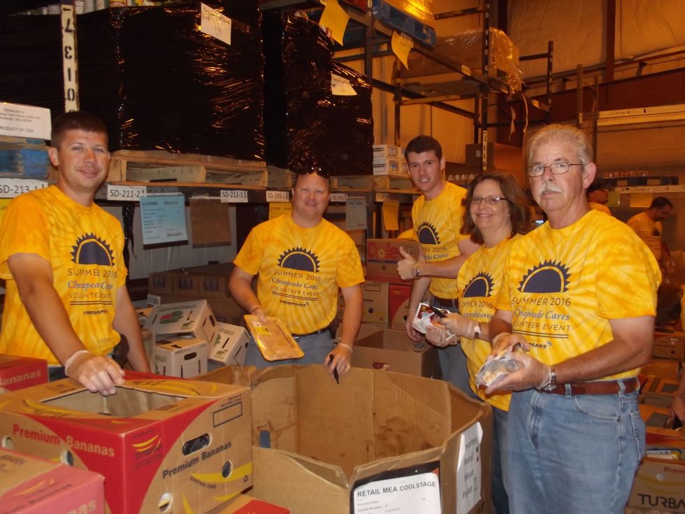 Employee volunteers at the Maryland Food Bank, left to right, are Chris Moorefield, Meter Technician II; Randy Johnson, Gas Operations Supervisor; Jared Shelton, Sales Representative; Beth Hoppes, Quality Assurance Supervisor; and Dave Bradford, Gas Operations Supervisor.